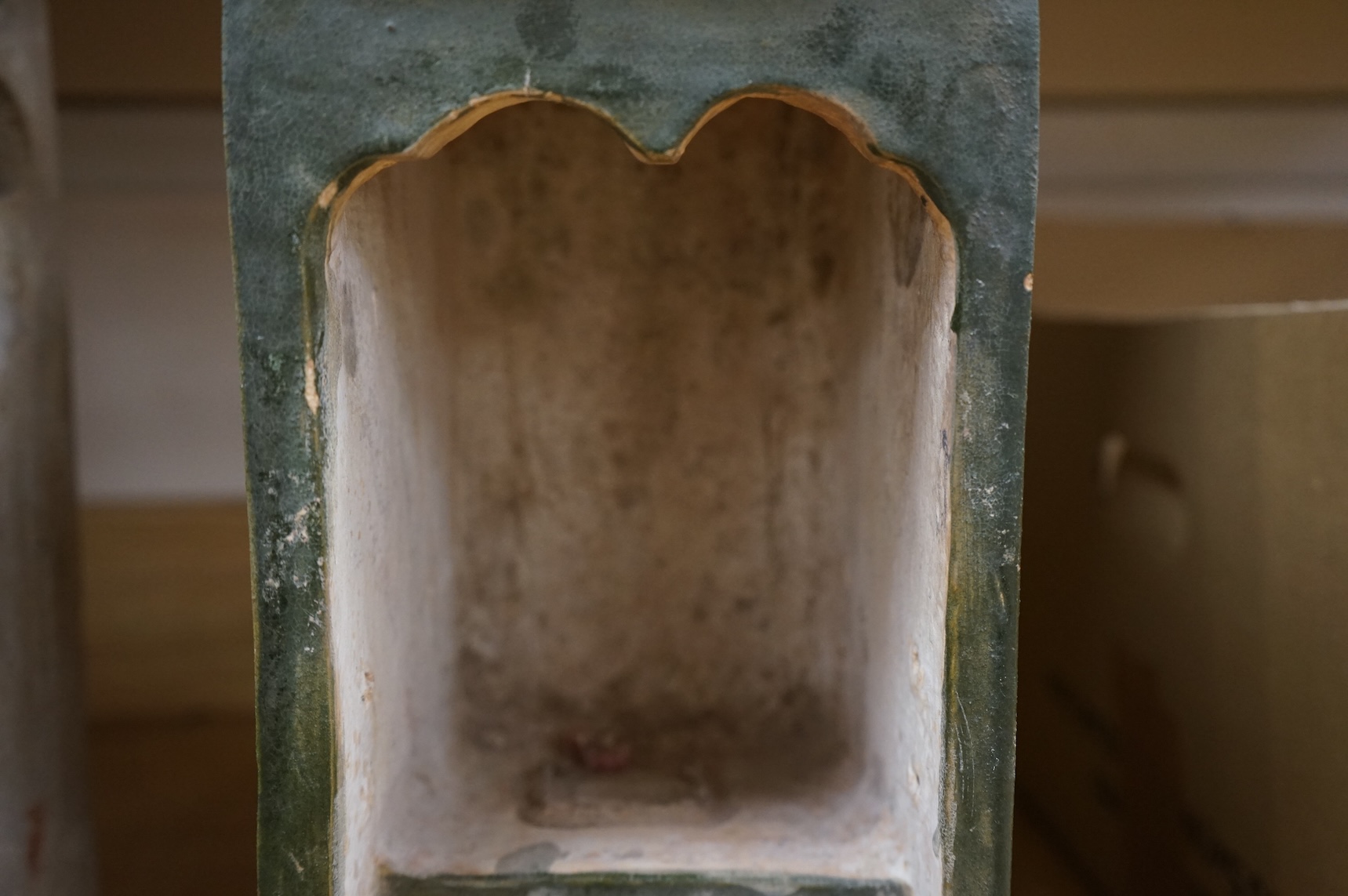 A Chinese Ming sancai glazed model of a cupboard and a shrine, 16th century, 40cm high
